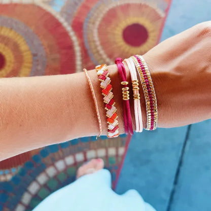 Gevlochten tilabead armband - zalm/oranje/bordeaux