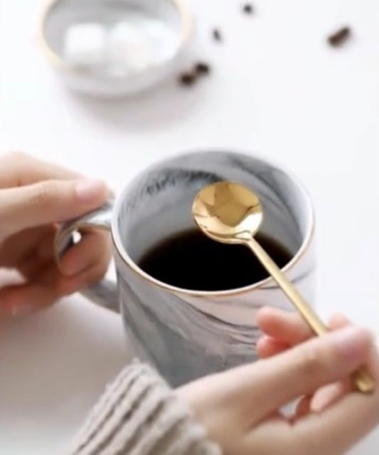 Goud kleurige koffie lepel