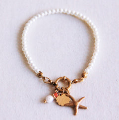 Parel armbandje met zeester, schelpje en parel